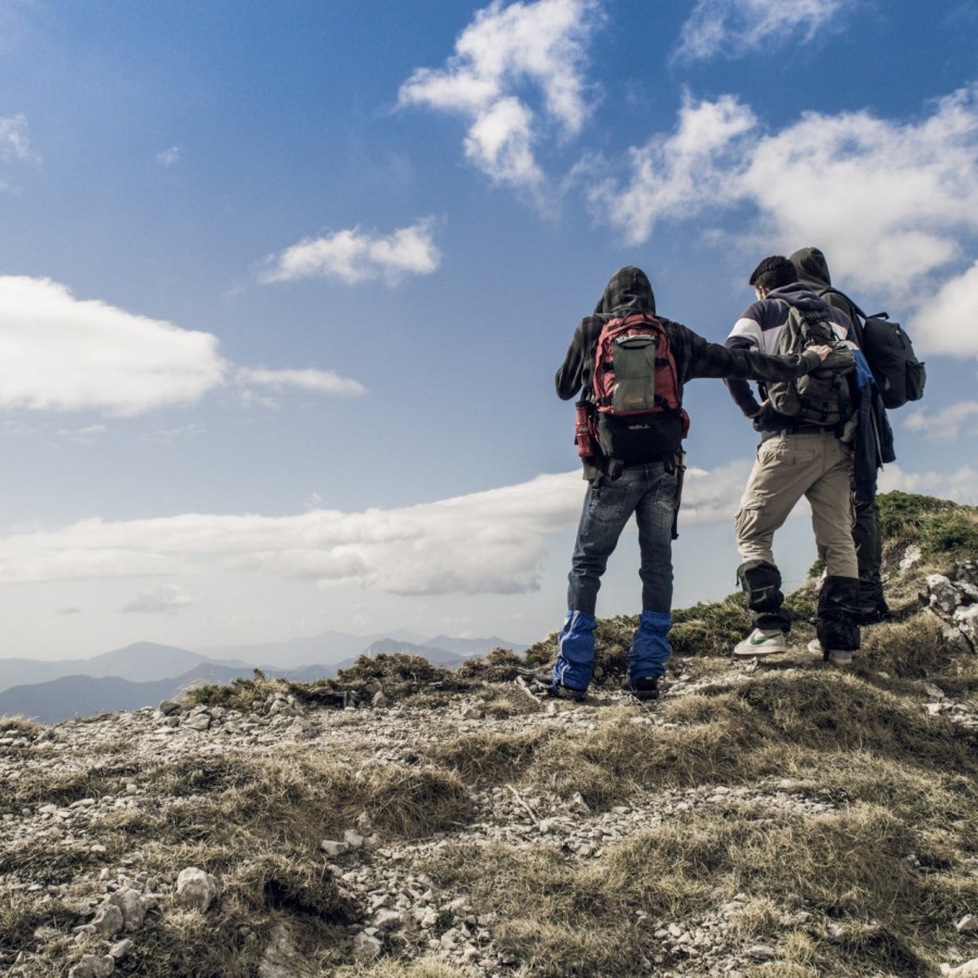People hiking on top of a mountain in Filignano, Italy. By fabrizio Verrecchiaon unsplash